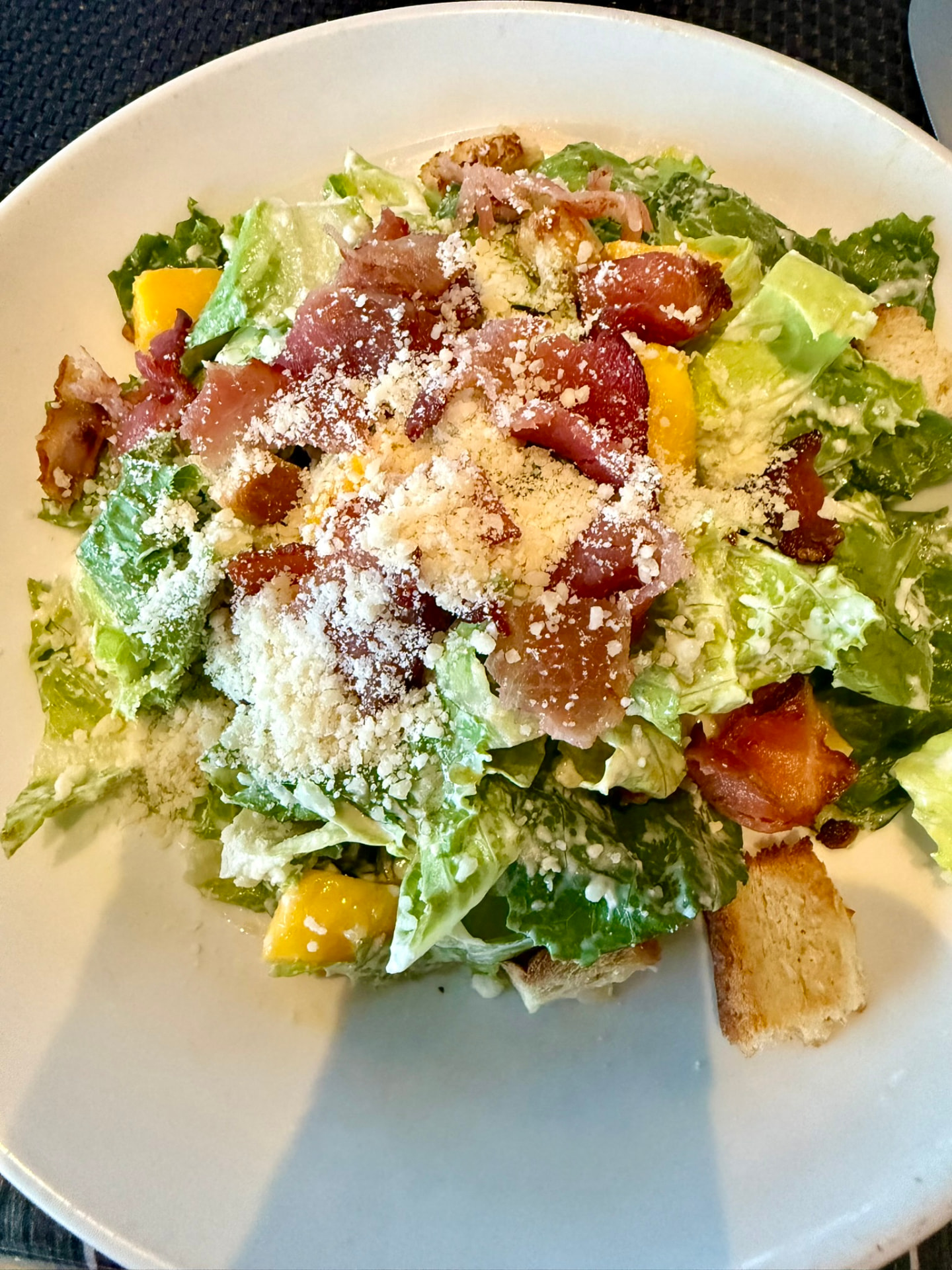 Chopped salad with crisp bacon, mango, parmesan and croutons