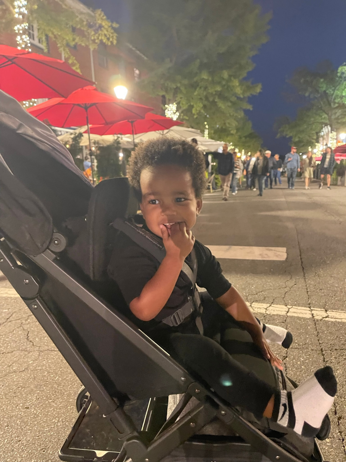 Toddler in a stroller on a King Street evening in Old Town Alexandria