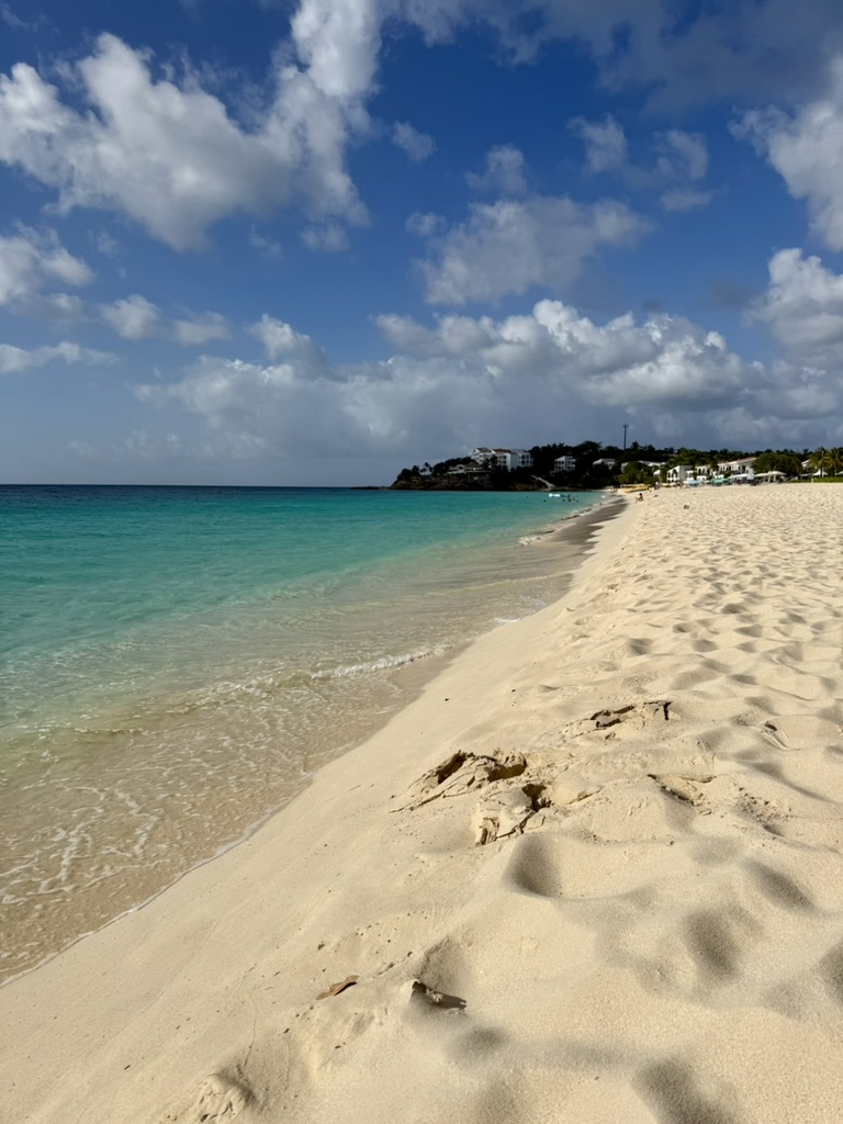 Clear turquoise water along the empty curve of Meads Bay