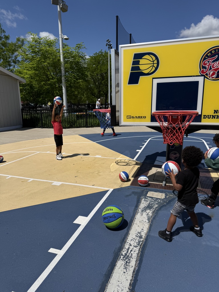 Preston shooting a basketball on the outdoor Pacers court at the Sports Legends Experience
