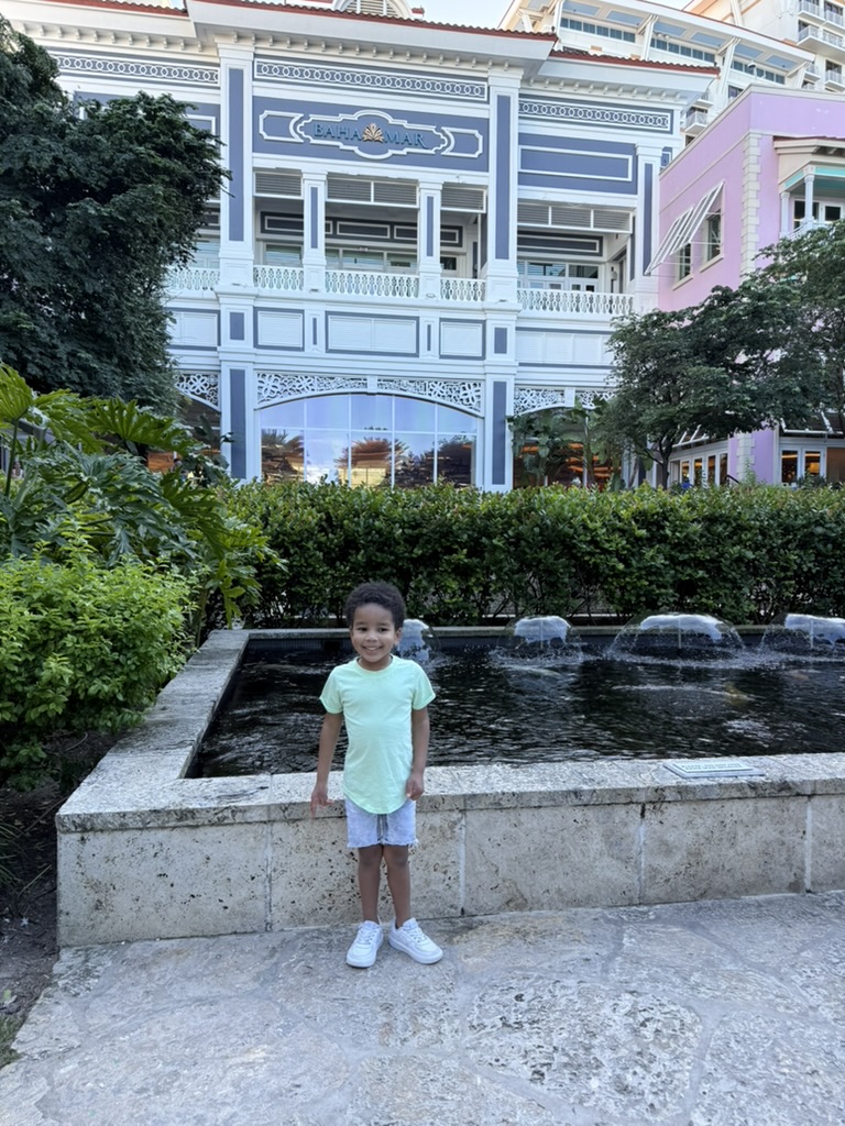 Our son standing by the fountains in front of the Baha Mar entrance